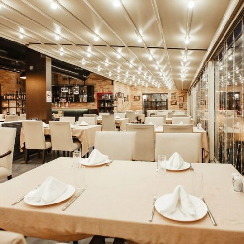 restaurant-hall-with-lots-table_140725-6309