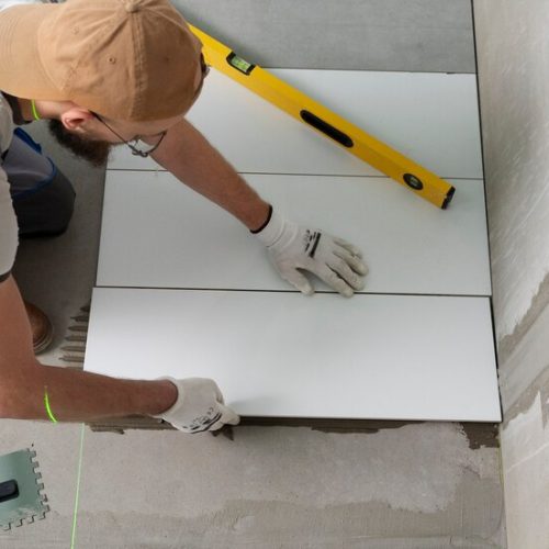 tiler-working-renovation-apartment_23-2149278631